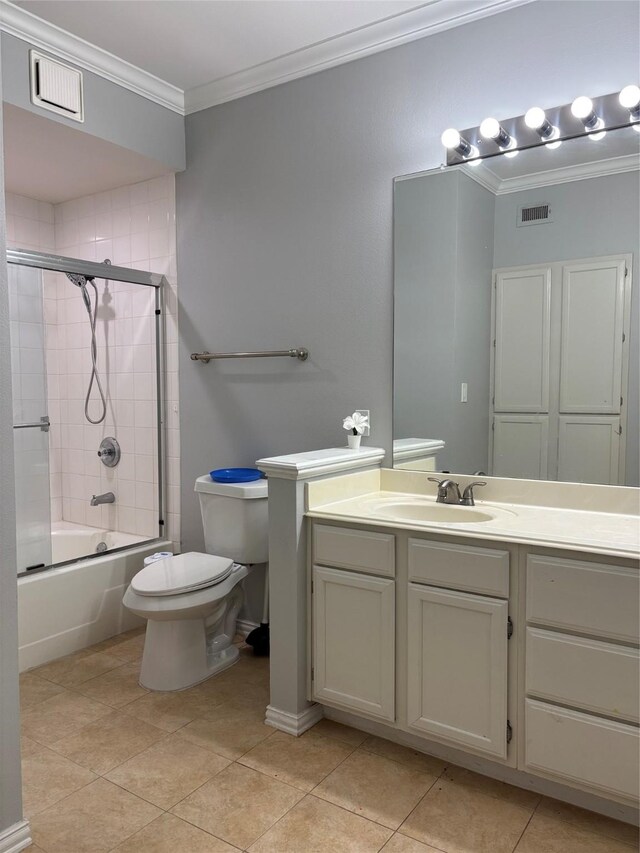 2111 Welch St Unit A307, Houston, TX 77019 - full bath featuring crown molding, tile patterned flooring, toilet, vanity, and bath / shower combo with glass door