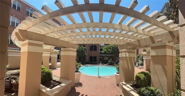2111 Welch St Unit A307, Houston, TX 77019 - community pool featuring a pergola and a patio