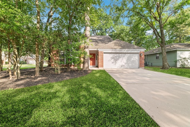 3 Whistlers Walk Pl, The Woodlands, TX 77381 - view of front of house with driveway, an attached garage, brick siding, a front lawn, and roof with shingles