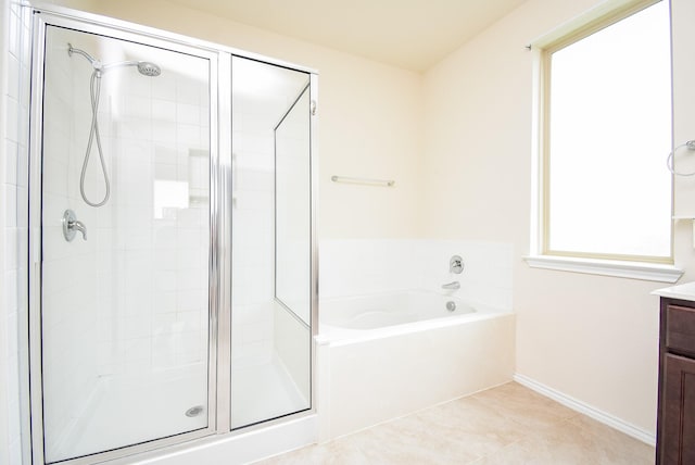 4622 Stolz Trl, Katy, TX 77493 - full bathroom with a shower stall, a garden tub, vanity, tile patterned floors, and baseboards