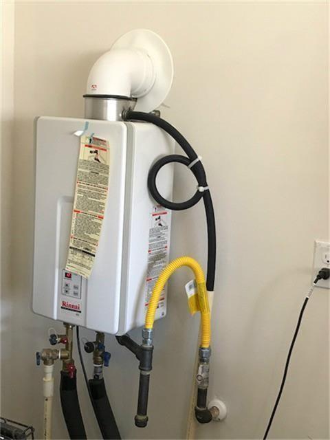 4622 Stolz Trl, Katy, TX 77493 - utility room with tankless water heater