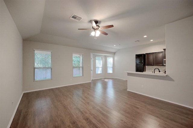 9533 E Woodmark, Conroe, TX 77304 - unfurnished living room featuring a ceiling fan, plenty of natural light, dark wood finished floors, and recessed lighting
