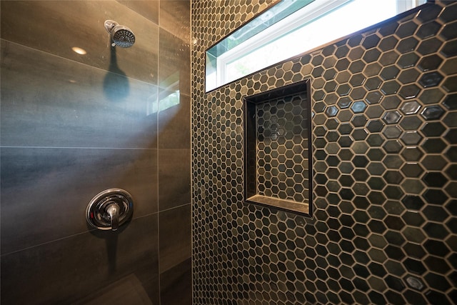 full bathroom with tiled shower