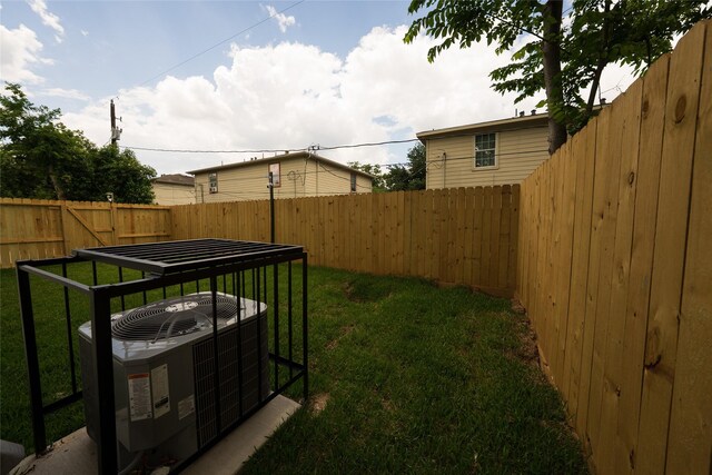 view of yard featuring central AC