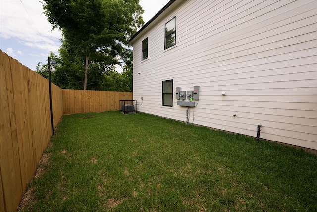 view of side of home featuring central AC