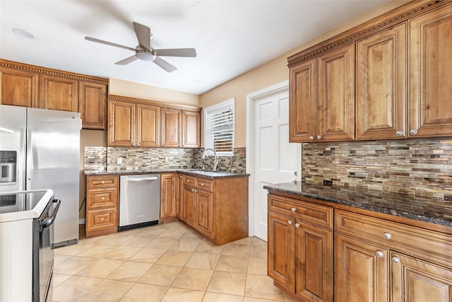 1741 Gardenia Dr, Houston, TX 77018 - kitchen featuring stainless steel appliances, brown cabinets, a sink, a ceiling fan, and backsplash