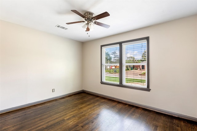 1741 Gardenia Dr, Houston, TX 77018 - empty room with dark wood finished floors, ceiling fan, and baseboards
