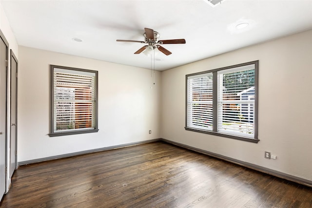 1741 Gardenia Dr, Houston, TX 77018 - unfurnished bedroom featuring dark wood finished floors, baseboards, and ceiling fan