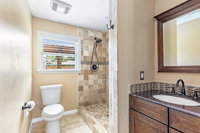 1741 Gardenia Dr, Houston, TX 77018 - full bath featuring toilet, a tile shower, vanity, and baseboards