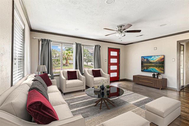 1741 Gardenia Dr, Houston, TX 77018 - living room featuring crown molding, wood finished floors, a textured ceiling, baseboards, and a ceiling fan