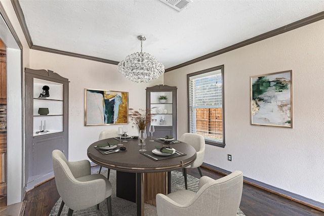 1741 Gardenia Dr, Houston, TX 77018 - dining space featuring ornamental molding, dark wood finished floors, a chandelier, and baseboards