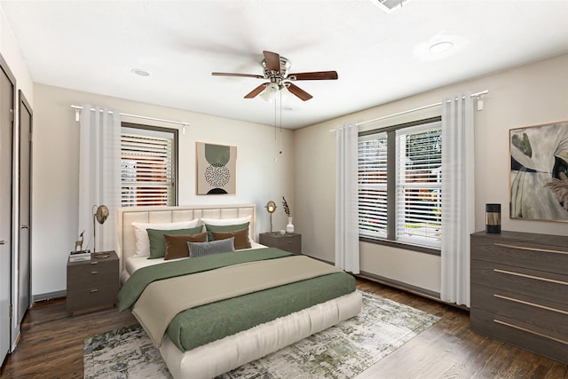 1741 Gardenia Dr, Houston, TX 77018 - bedroom with dark wood-style floors, a ceiling fan, and baseboards