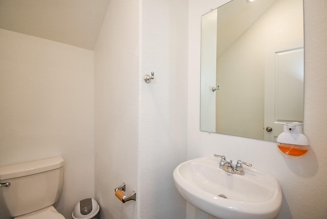 7303 Dover View Ln, Katy, TX 77493 - bathroom with a sink, toilet, and lofted ceiling