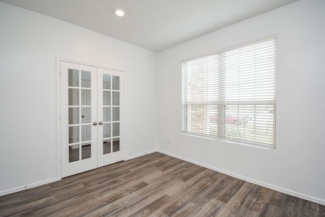 7303 Dover View Ln, Katy, TX 77493 - spare room featuring french doors, dark wood finished floors, baseboards, and recessed lighting