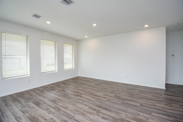 7303 Dover View Ln, Katy, TX 77493 - empty room with wood finished floors, recessed lighting, and baseboards