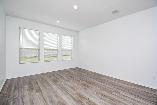 7303 Dover View Ln, Katy, TX 77493 - unfurnished room featuring wood finished floors, baseboards, and recessed lighting