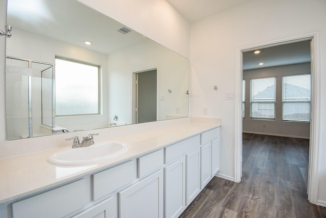7303 Dover View Ln, Katy, TX 77493 - full bath featuring healthy amount of natural light, wood finished floors, vanity, baseboards, and recessed lighting