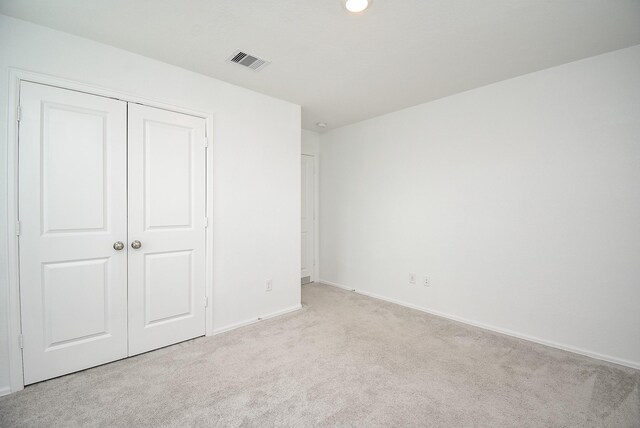 7303 Dover View Ln, Katy, TX 77493 - unfurnished bedroom with carpet floors, a closet, and baseboards