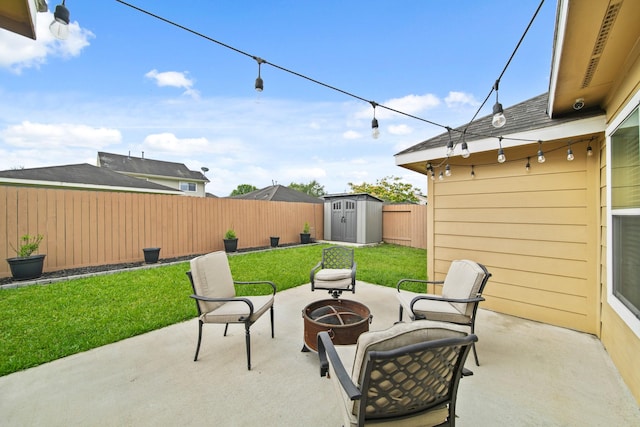 view of patio / terrace with a fire pit, a storage unit, and an outdoor structure