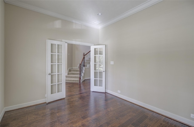 spare room featuring french doors, ornamental molding, baseboards, stairway, and dark wood-style floors