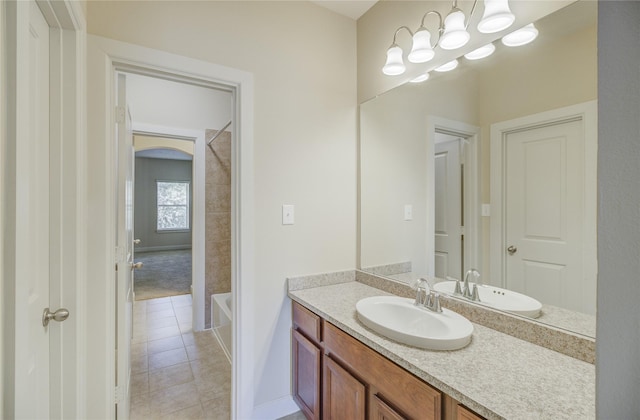 full bathroom featuring tile patterned flooring, vanity, shower / bath combination, and baseboards