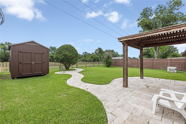 view of yard with a patio area, a storage shed, a pergola, and an outbuilding