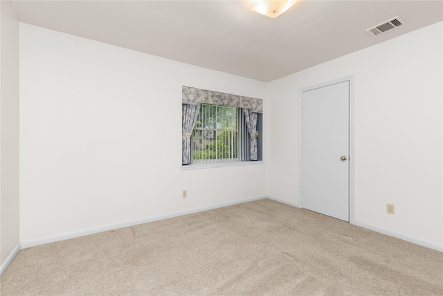 carpeted spare room with baseboards