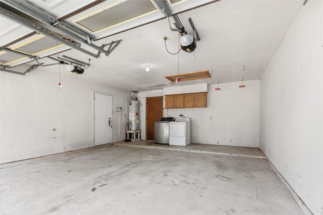 garage with gas water heater, washing machine and clothes dryer, and a garage door opener