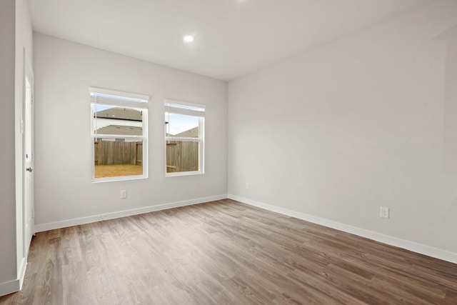 11664 Wilgers Way, Willis, TX 77378 - unfurnished room with wood finished floors, baseboards, and recessed lighting