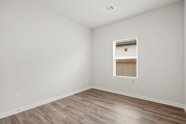 11664 Wilgers Way, Willis, TX 77378 - spare room with wood finished floors and baseboards