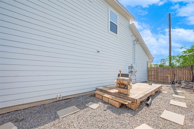 view of side of property with fence