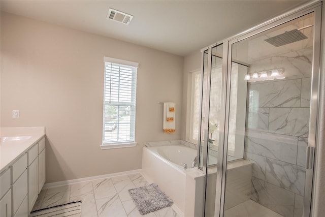 14707 Fairy Tern Ln, Houston, TX 77049 - full bathroom with marble look tile flooring, healthy amount of natural light, baseboards, and a bath