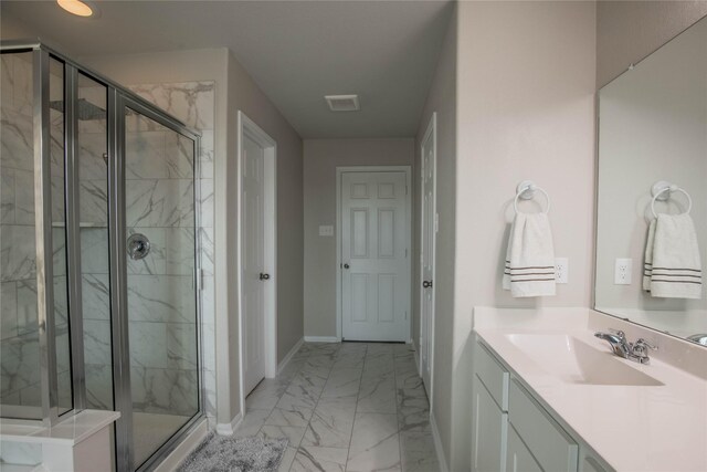 14707 Fairy Tern Ln, Houston, TX 77049 - bathroom with marble finish floors, baseboards, a marble finish shower, and vanity