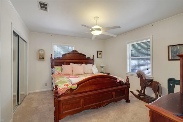 111 Circle Dr, Cleveland, TX 77327 - bedroom featuring light colored carpet, ornamental molding, a ceiling fan, and a closet