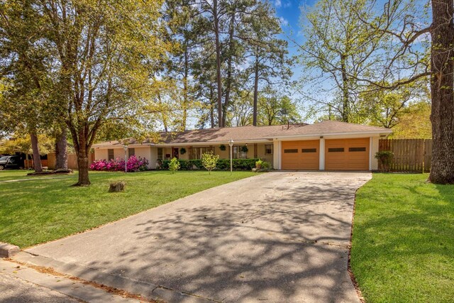 111 Circle Dr, Cleveland, TX 77327 - ranch-style house with a garage and concrete driveway