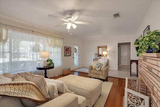 111 Circle Dr, Cleveland, TX 77327 - living room with a ceiling fan, crown molding, and wood finished floors