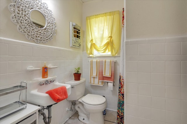 111 Circle Dr, Cleveland, TX 77327 - full bath with tile walls, tile patterned floors, and wainscoting