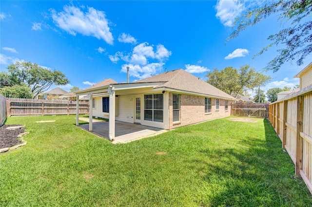 1826 Oak Lodge Dr, Pearland, TX 77581 - rear view of house with a patio, brick siding, and roof with shingles