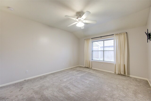 1826 Oak Lodge Dr, Pearland, TX 77581 - empty room featuring baseboards, light colored carpet, lofted ceiling, a smoke detector, and a ceiling fan