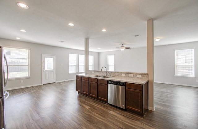 3514 Vivaldi Dr, Katy, TX 77493 - kitchen with stainless steel appliances, a sink, open floor plan, ceiling fan, and dark wood-style flooring