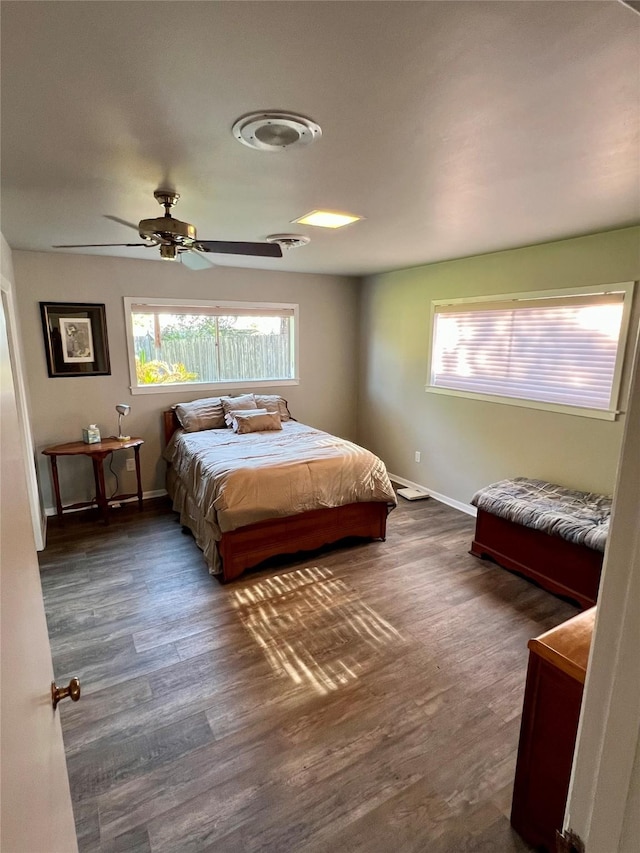 205 Cathy Dr, Hallettsville, TX 77964 - bedroom featuring dark wood finished floors, baseboards, and a ceiling fan