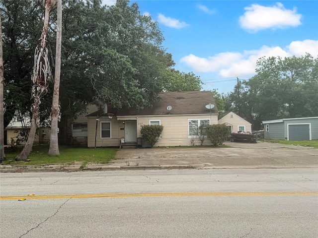 210 Park St, Baytown, TX 77520 - view of front of house featuring driveway, entry steps, and a garage
