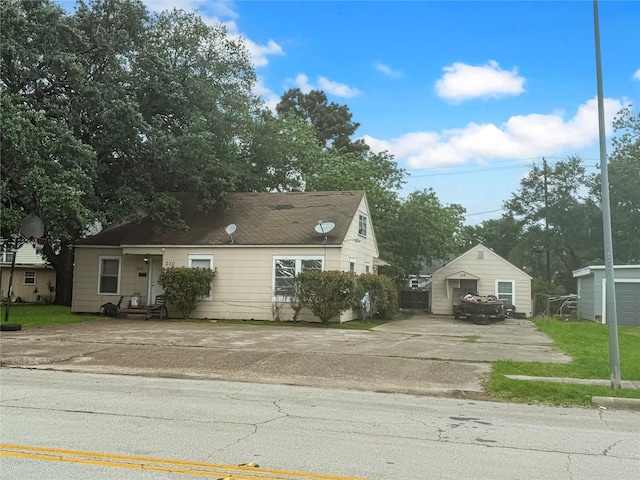 210 Park St, Baytown, TX 77520 - view of home's exterior featuring an outbuilding and driveway