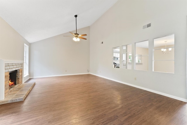 12215 Oldenburg Ln, Houston, TX 77065 - unfurnished living room featuring high vaulted ceiling, a fireplace, healthy amount of natural light, baseboards, and wood finished floors