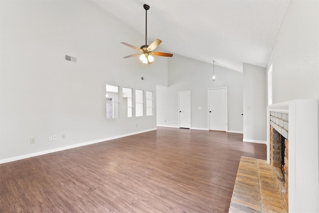 12215 Oldenburg Ln, Houston, TX 77065 - unfurnished living room with high vaulted ceiling, ceiling fan, a fireplace, baseboards, and wood finished floors