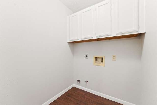 12215 Oldenburg Ln, Houston, TX 77065 - washroom featuring cabinet space, electric dryer hookup, hookup for a washing machine, dark wood-type flooring, and hookup for a gas dryer