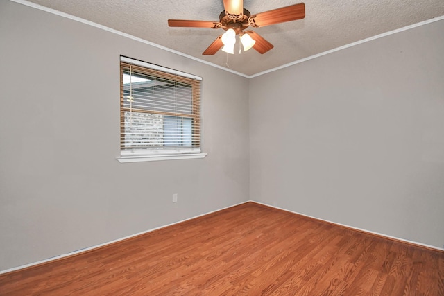 15011 Cypress Ridge Dr, Cypress, TX 77429 - spare room with wood finished floors, a textured ceiling, a ceiling fan, and ornamental molding