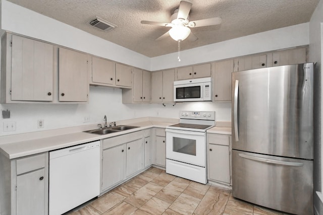 15011 Cypress Ridge Dr, Cypress, TX 77429 - kitchen with white appliances, a sink, a textured ceiling, ceiling fan, and light countertops