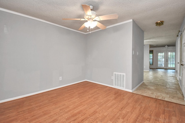 15011 Cypress Ridge Dr, Cypress, TX 77429 - unfurnished room with ceiling fan, light wood-style flooring, a textured ceiling, baseboards, and ornamental molding