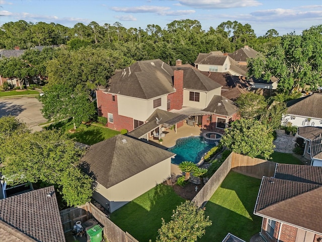 aerial perspective of suburban area featuring a pool area